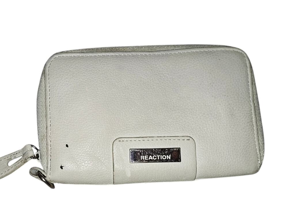 Kenneth Cole Reaction women's white zip-around wallet.